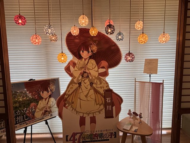 アニメ企画の等身大スタンディと水引装飾