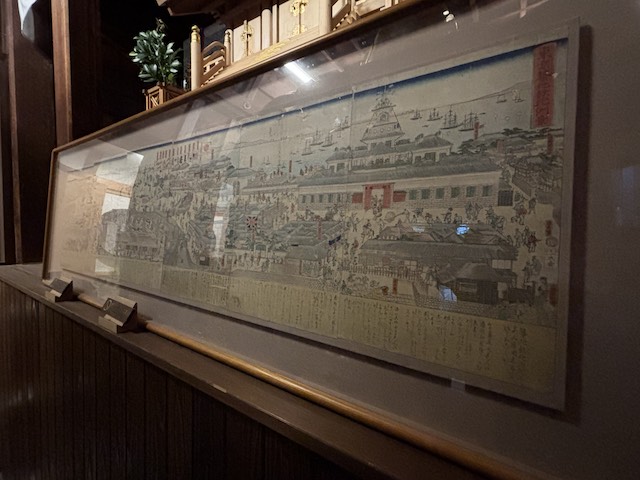 波除神社に展示された明治初期の築地ホテル館と周辺の街並みを描いた錦絵